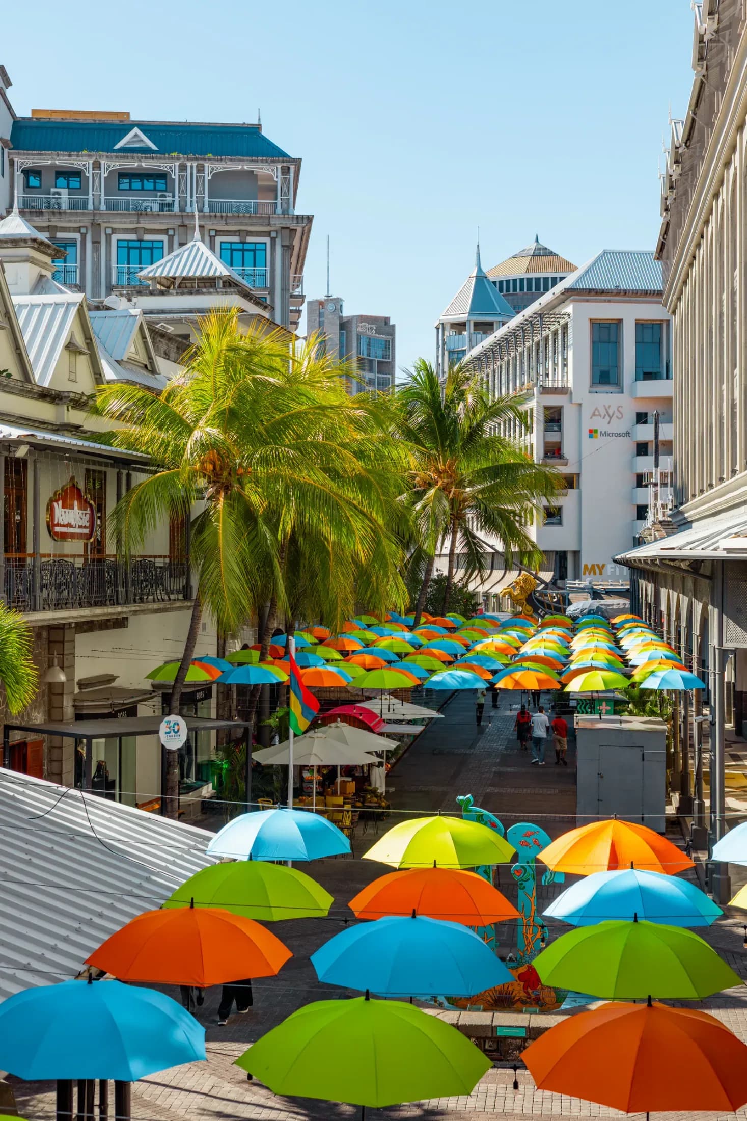 Colourful umbrellas above the Caudan Waterfront lanes