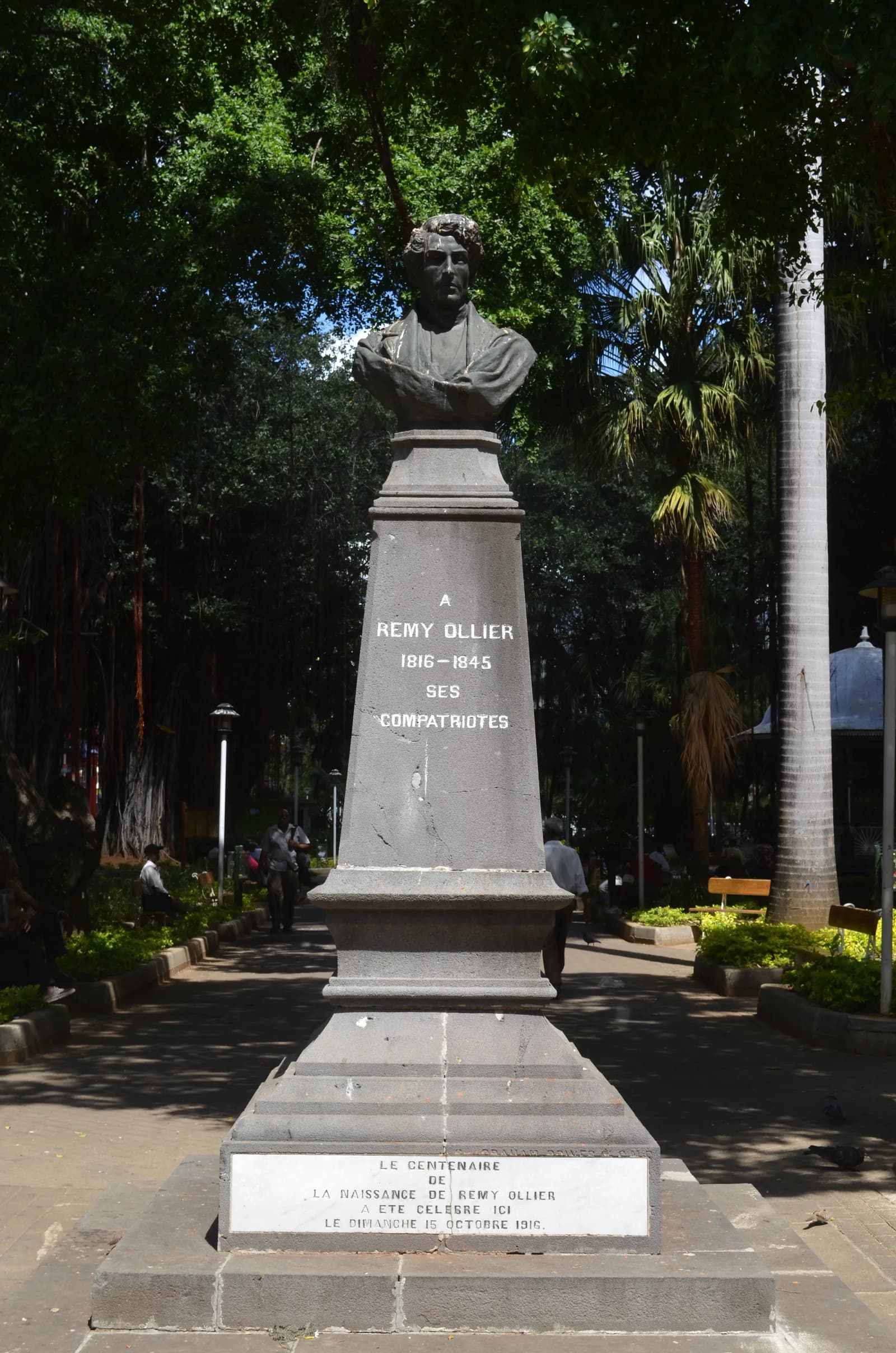 The Rémy Ollier memorial beneath the trees in Jardin de la Compagnie